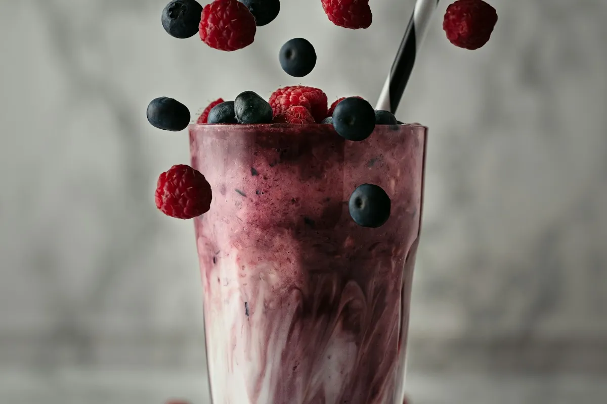 Chocolate milkshake with toppings, like a 7 Brew Rocky Road Shake