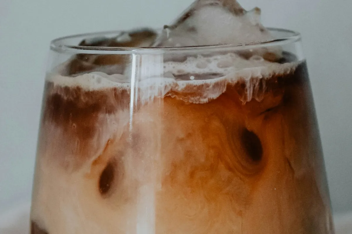 Layered iced macchiato with milk and espresso, like a 7 Brew Salted Caramel Macchiato